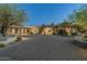 Stunning custom home with stone accents, desert landscaping and paver driveway creates inviting curb appeal at 41611 N 113Th Pl, Scottsdale, AZ 85262