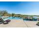 Inviting infinity pool with lounge chairs and lake views at 41611 N 113Th Pl, Scottsdale, AZ 85262