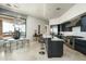 Bright, open kitchen with stainless steel appliances, modern finishes, and seamless access to outdoor dining area at 41611 N 113Th Pl, Scottsdale, AZ 85262