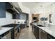 Spacious kitchen featuring stainless steel appliances, sleek cabinetry, and a seamless connection to the living area at 41611 N 113Th Pl, Scottsdale, AZ 85262