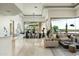 Bright open concept featuring living room, dining area, and bar with views to the backyard at 41611 N 113Th Pl, Scottsdale, AZ 85262