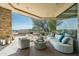 Inviting outdoor lounge area with comfortable seating, scenic views, and a stylish desert design at 41611 N 113Th Pl, Scottsdale, AZ 85262