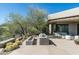 Scenic outdoor patio with lounge area, fire pit, and breathtaking desert views at 41611 N 113Th Pl, Scottsdale, AZ 85262