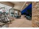 Outdoor patio with a hanging chair, seating area, and outdoor bar at 41611 N 113Th Pl, Scottsdale, AZ 85262