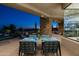 Patio with outdoor seating area, putting green, and desert mountain views at 41611 N 113Th Pl, Scottsdale, AZ 85262