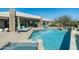 Inviting backyard pool with stylish lounge chairs and desert landscaping perfect for relaxation at 41611 N 113Th Pl, Scottsdale, AZ 85262