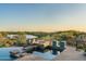 Beautiful pool featuring a central fire pit, offering serene views of the golf course at 41611 N 113Th Pl, Scottsdale, AZ 85262