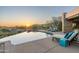 Stunning pool and patio area with lounge chairs and a beautiful view of the surrounding landscape at 41611 N 113Th Pl, Scottsdale, AZ 85262