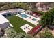Expansive aerial view of a luxury estate with a pool, gazebo, fire pit, putting green, and manicured grounds at 5220 N Casa Blanca Dr, Paradise Valley, AZ 85253