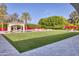 Expansive backyard featuring a well-maintained lawn, pool, and stylish outdoor lounging areas at 5220 N Casa Blanca Dr, Paradise Valley, AZ 85253