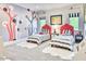 Charming bedroom featuring twin beds, playful decor, and bright natural light at 5220 N Casa Blanca Dr, Paradise Valley, AZ 85253