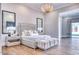 Bedroom featuring decorative chandelier, hardwood floors, and neutral decor at 5220 N Casa Blanca Dr, Paradise Valley, AZ 85253