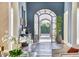 Stylish foyer with dark hardwood floors, arched doorway, elegant mirror and tasteful décor elements at 5220 N Casa Blanca Dr, Paradise Valley, AZ 85253