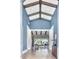 Elegant foyer with herringbone floors and view to the backyard, beams, and blue walls at 5220 N Casa Blanca Dr, Paradise Valley, AZ 85253