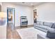 Spacious living room with hardwood floors, a stylish rug, and views into other rooms at 5220 N Casa Blanca Dr, Paradise Valley, AZ 85253