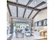 Bright and airy living room featuring high ceilings with exposed beams, a fireplace and seamless indoor-outdoor flow at 5220 N Casa Blanca Dr, Paradise Valley, AZ 85253