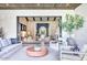 Comfortable living room with a view to the foyer and front room, with neutral furniture and modern decor at 5220 N Casa Blanca Dr, Paradise Valley, AZ 85253