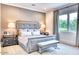 Serene main bedroom with a luxurious upholstered bed, neutral tones, and natural light at 5220 N Casa Blanca Dr, Paradise Valley, AZ 85253
