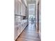 Walk-in pantry features custom cabinets, granite countertops, and seamless access to the dining room at 5220 N Casa Blanca Dr, Paradise Valley, AZ 85253
