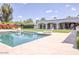 Beautiful swimming pool area with lounge chairs and manicured landscaping enhancing the outdoor living space at 5220 N Casa Blanca Dr, Paradise Valley, AZ 85253