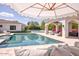 Inviting pool area featuring a covered gazebo, lush landscaping, and comfortable seating areas, ideal for outdoor entertaining at 5220 N Casa Blanca Dr, Paradise Valley, AZ 85253