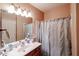 Bathroom featuring a vanity sink, mirror, and shower with curtain at 5450 E Deer Valley Dr # 1201, Phoenix, AZ 85054