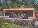 Community sign for Toscana of Desert Ridge with colorful flowers and plants around its base at 5450 E Deer Valley Dr # 1201, Phoenix, AZ 85054