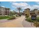 A well-manicured entrance to Palazzo Grande, showcasing lush landscaping and inviting pathways at 5450 E Deer Valley Dr # 1201, Phoenix, AZ 85054