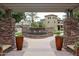 A serene water fountain surrounded by decorative planters and lush greenery in a community space at 5450 E Deer Valley Dr # 1201, Phoenix, AZ 85054