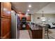 Efficient kitchen with stainless steel appliances, granite countertops, and breakfast bar seating at 5450 E Deer Valley Dr # 1201, Phoenix, AZ 85054