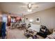 Open concept living room view from kitchen with sofa, dining table, and carpeted floors at 5450 E Deer Valley Dr # 1201, Phoenix, AZ 85054