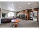 Cozy living room with a fireplace, comfortable seating, and ample natural light at 5450 E Deer Valley Dr # 1201, Phoenix, AZ 85054