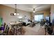 Spacious living room and dining room area featuring carpet, dining table, and sofa at 5450 E Deer Valley Dr # 1201, Phoenix, AZ 85054