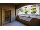 Outdoor patio showing building and landscaping views and a glass door to the interior at 5450 E Deer Valley Dr # 1201, Phoenix, AZ 85054