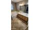 Bright bathroom with double vanity, tile floor, and soaking tub at 5734 W Gwen St, Laveen, AZ 85339