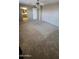 Spacious bedroom with ceiling fan, natural light, and ensuite bathroom at 5734 W Gwen St, Laveen, AZ 85339