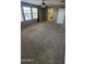 Large primary bedroom with ceiling fan, natural light, and ensuite bathroom at 5734 W Gwen St, Laveen, AZ 85339