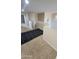 Neutral hallway with dark rug leading into bedrooms and bathrooms at 5734 W Gwen St, Laveen, AZ 85339