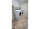 Bright laundry room featuring full sized LG washer and dryer on a tile floor with shelving at 5734 W Gwen St, Laveen, AZ 85339