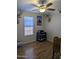 Bedroom showcasing wood-look flooring, a ceiling fan, and natural light from a window at 7300 N 51St Ave # A259, Glendale, AZ 85301