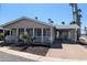 Charming single-story home featuring a covered porch and carport at 7300 N 51St Ave # A259, Glendale, AZ 85301
