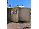 The side of the home includes a small storage area and access to electrical components at 7300 N 51St Ave # A259, Glendale, AZ 85301
