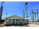 Charming single-story home featuring a covered carport, well-maintained yard, and mature palm trees at 7300 N 51St Ave # A259, Glendale, AZ 85301