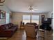 Cozy living room featuring hardwood flooring, neutral walls, and comfortable furnishings at 7300 N 51St Ave # A259, Glendale, AZ 85301