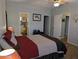 Bright main bedroom with wood floors and doors to bathroom and walk-in closet at 7300 N 51St Ave # A259, Glendale, AZ 85301