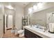Bathroom featuring a double vanity, tile flooring, and a separate toilet area at 7433 W Darrel Rd, Laveen, AZ 85339