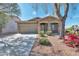 Charming one-story home featuring a two car garage, desert landscaping, and covered entry at 7433 W Darrel Rd, Laveen, AZ 85339