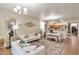 Comfortable living space with stylish decor flowing into dining area and open kitchen at 7433 W Darrel Rd, Laveen, AZ 85339