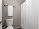 Bathroom with a toilet, towel rack, and a shower at 7670 W Sands Dr, Peoria, AZ 85383