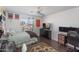Bedroom featuring a bed, a dresser, a ceiling fan, and decor at 7670 W Sands Dr, Peoria, AZ 85383